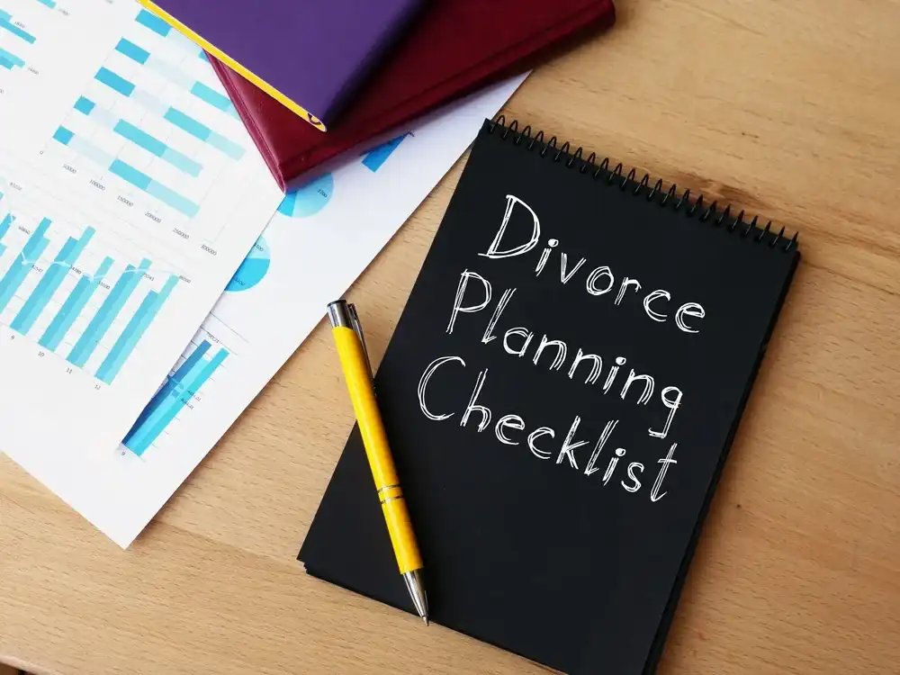 Notebook that reads "Divorce Planning Checklist" on the cover