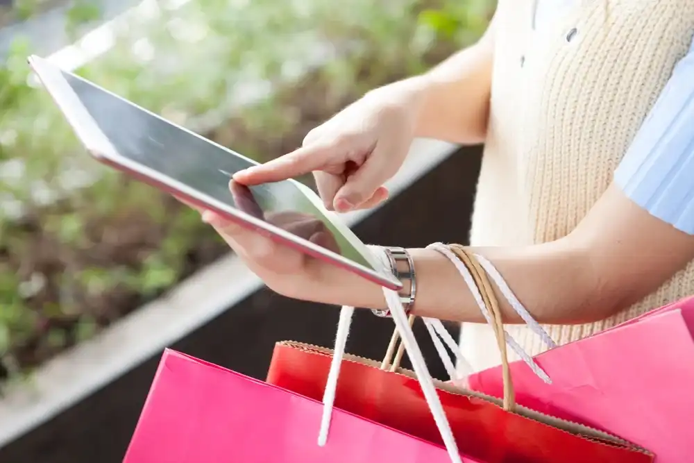 A woman researching spending habits on her tablet