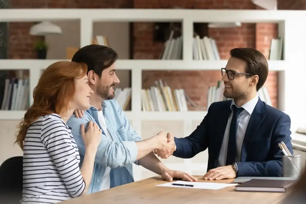 A couple meeting with a loan officer