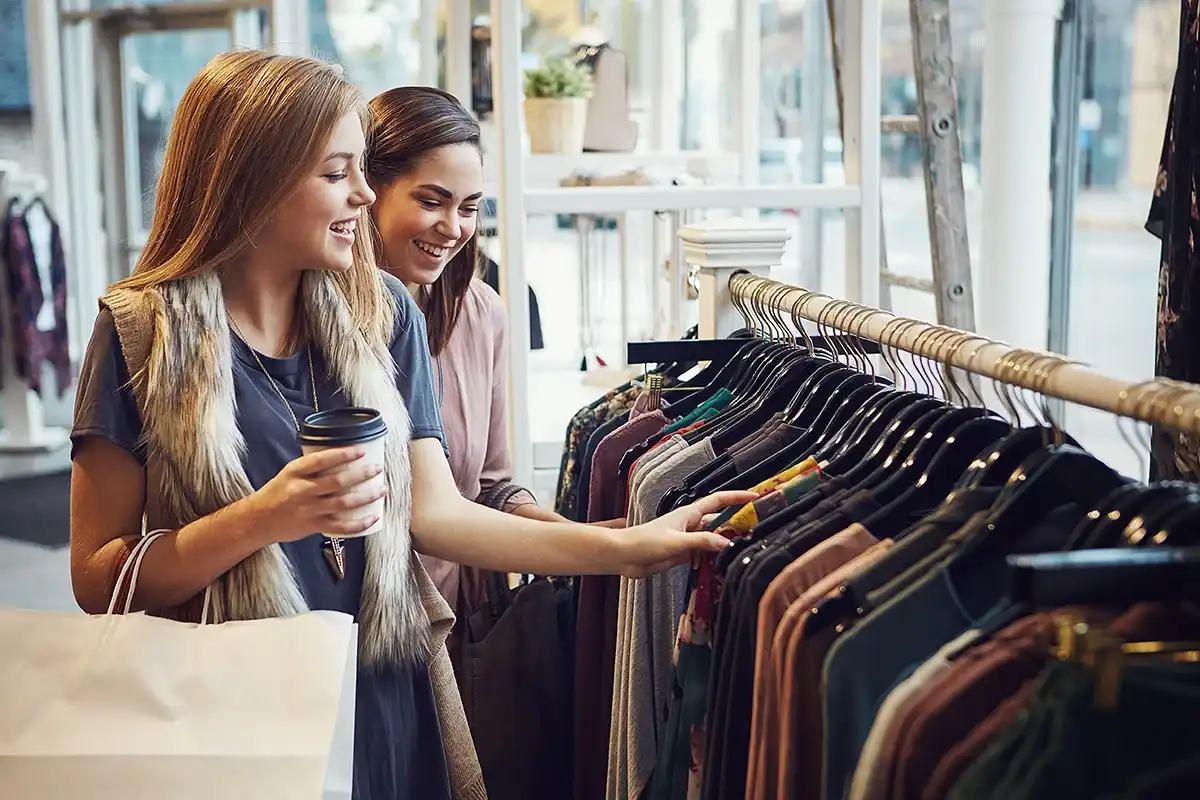 Friends shopping at a store in person together