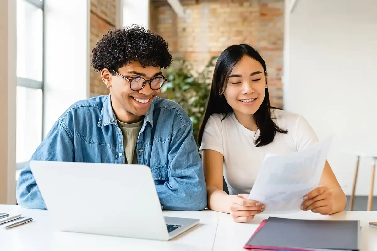 A couple looking up student loan repayment options