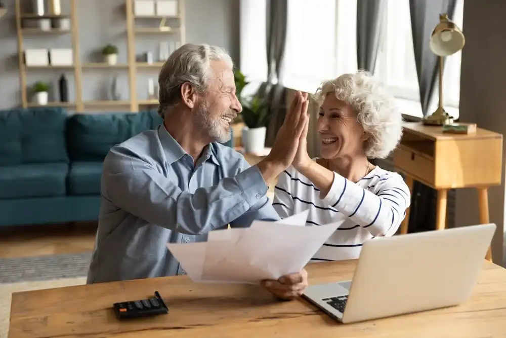 Elderly couple using a budgeting app for their finances